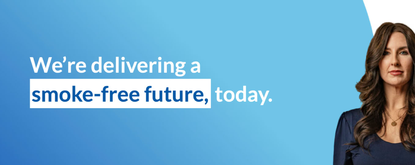 A woman with long brown hair is on the right side of the image, wearing a dark blue top. The background is a gradient of blue, with white text on the left that reads, "We're delivering a smoke-free future, today."